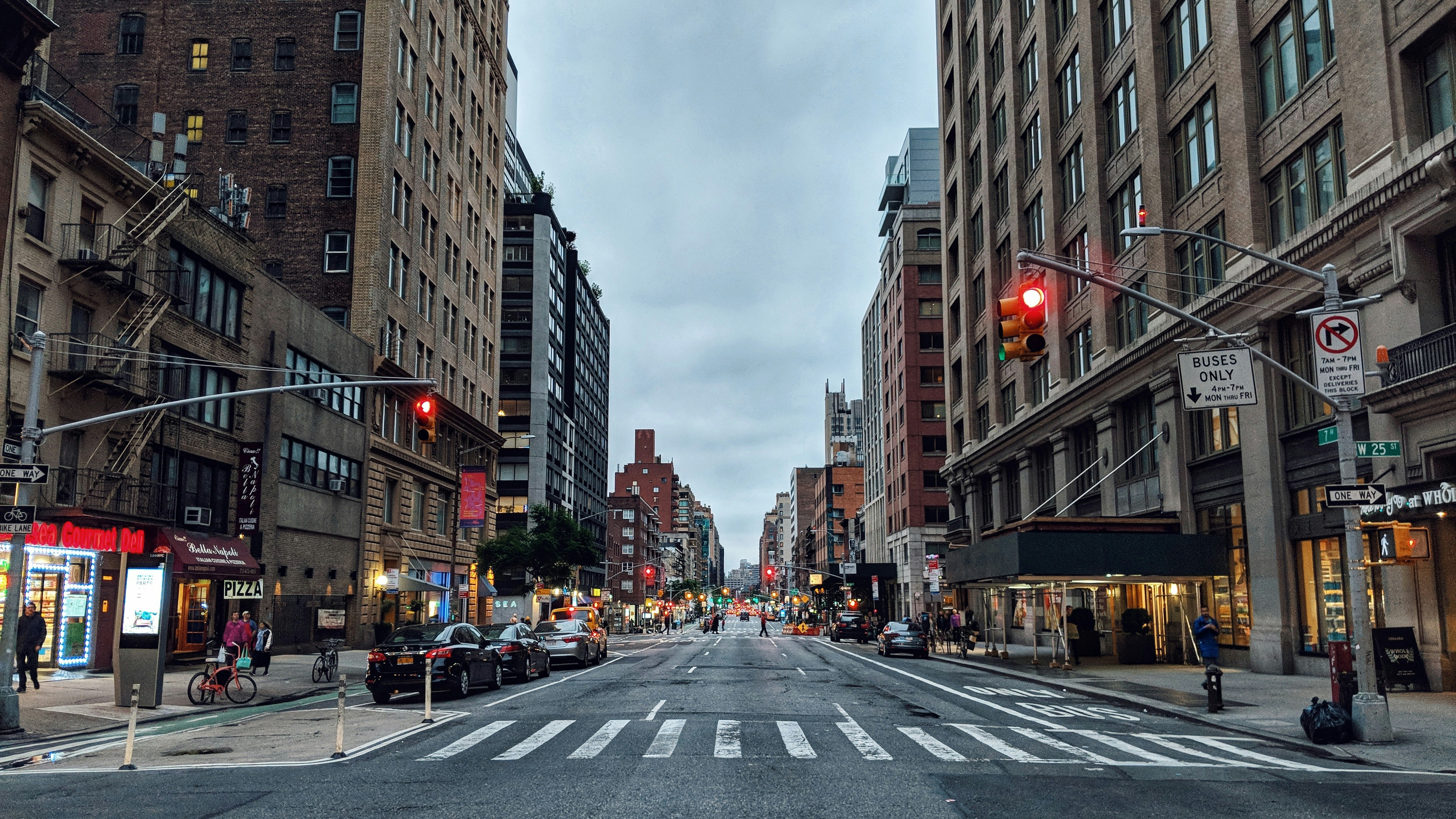 Busy city street lined with tall buildings